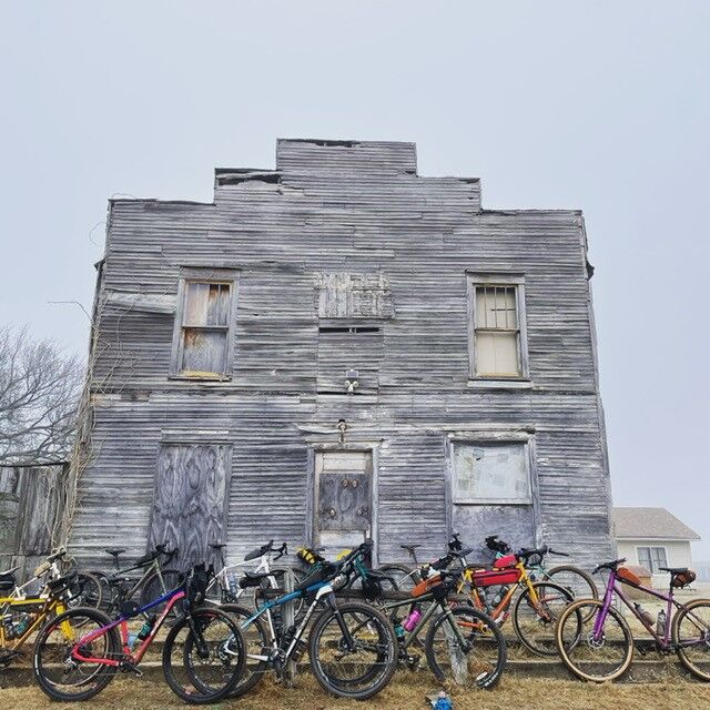 Bicycles leaned against building